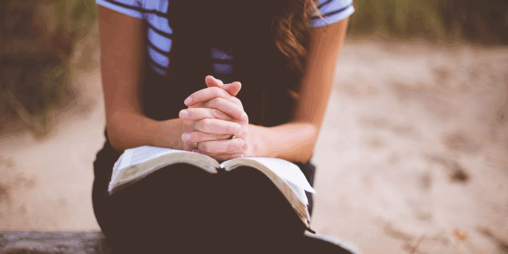 Woman praying for joy